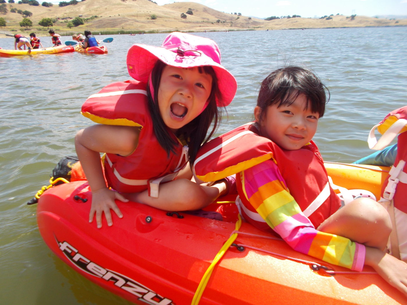 kids kayaking at summer camp