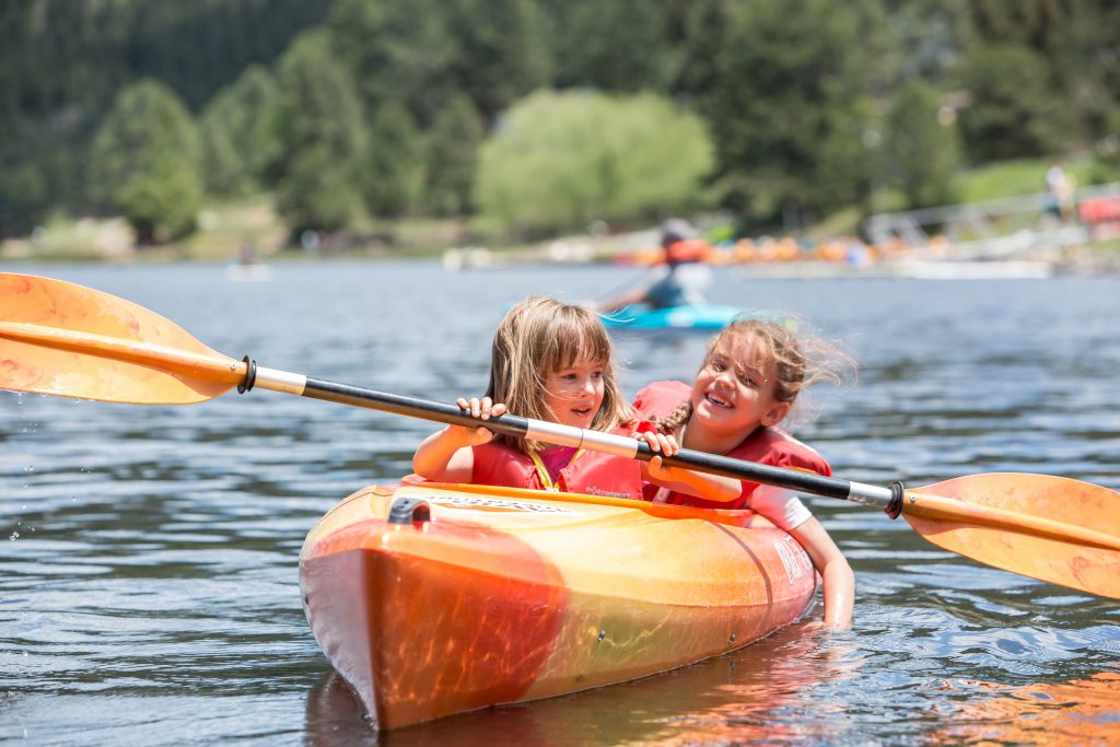 Girls kayaking at summer camp