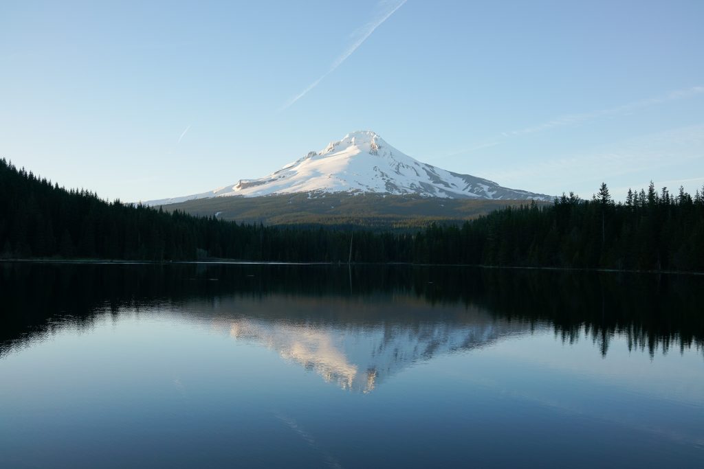 Trillium Lake surrounded by blue skies